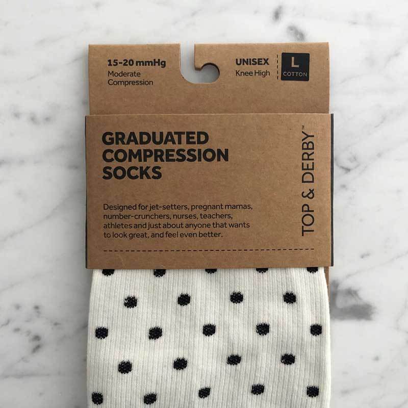 Compression socks and packaging with white and black dots