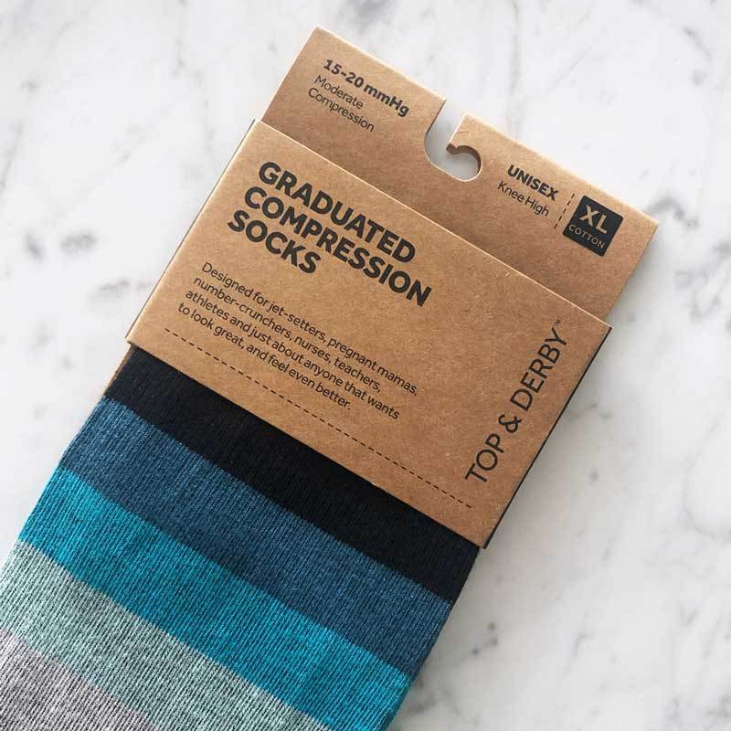 Blue and black striped compression support socks in packaging