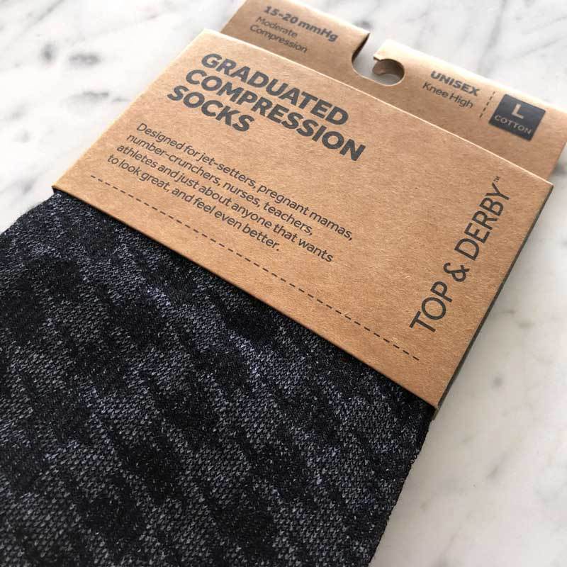 Houndstooth pattern designer compression socks in black and grey in packaging